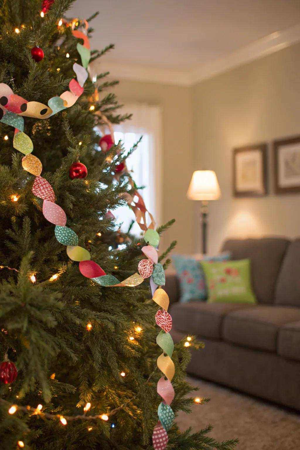 A Christmas tree adorned with a vibrant paper connection decoration.