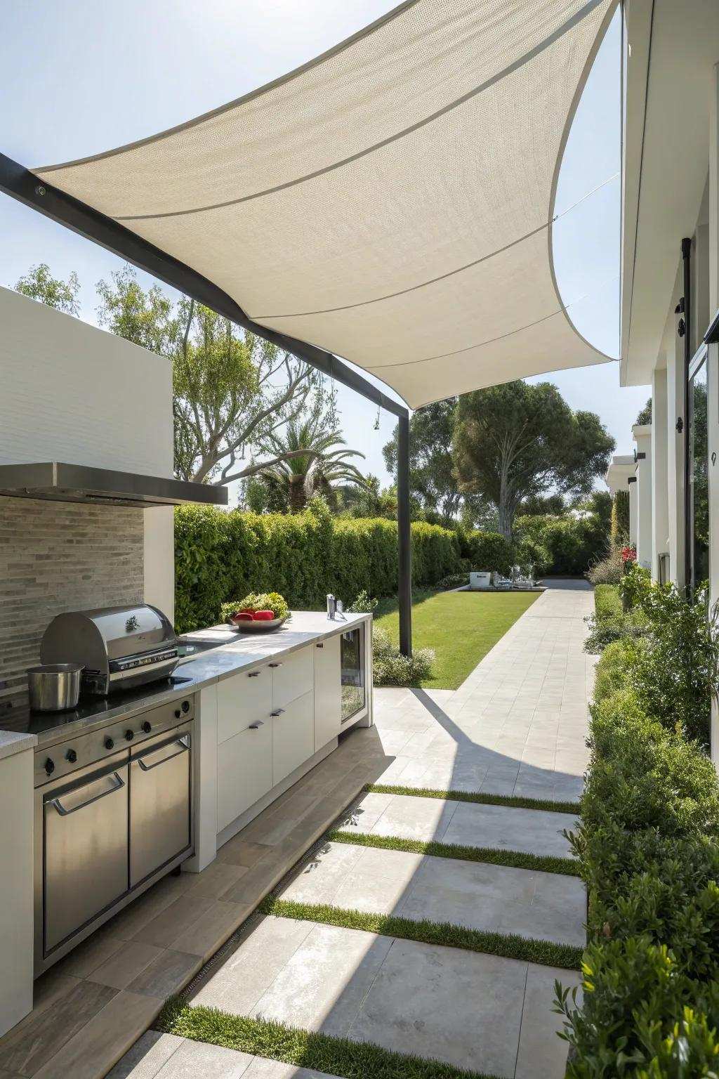 A shade sail provides a sleek and contemporary cover for your outdoor cooking area.