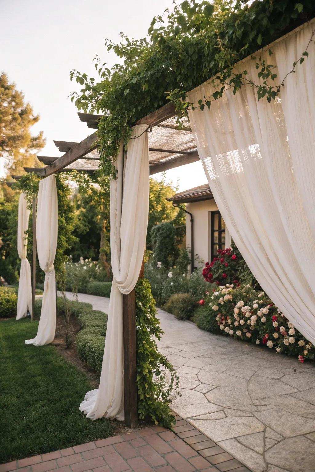 An arbor with drapes adds elegance and privacy.
