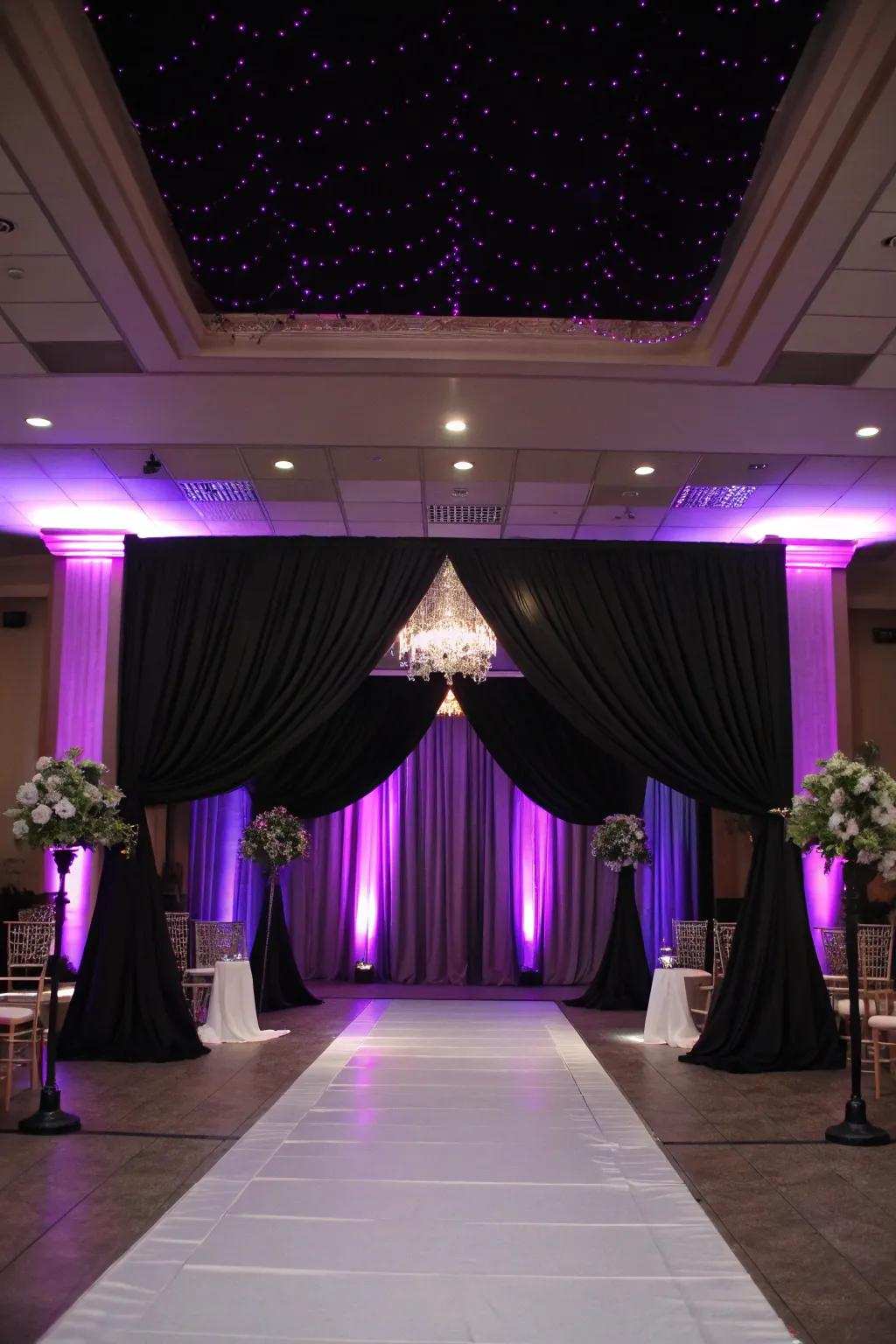 Dramatic illumination featuring violet uplighting and onyx drapery.