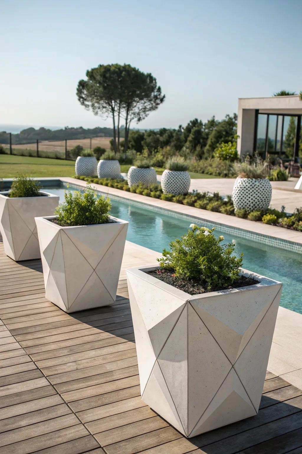 Elegant structure with architectural containers on the pool deck.