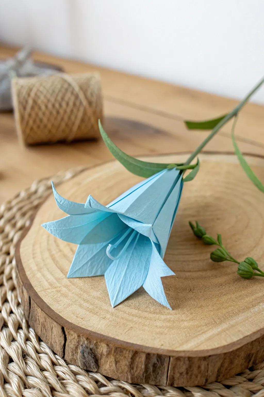 Embrace the charm of simplicity with this delicate paper bluebell, where minimalist design meets natural elegance.