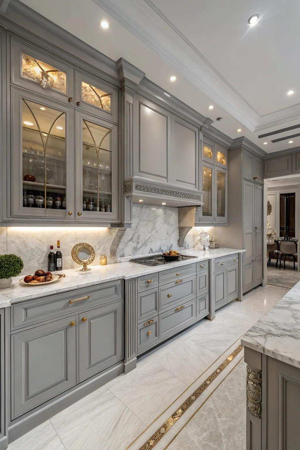 Stone counters add luxury and elegance to gray cabinets.